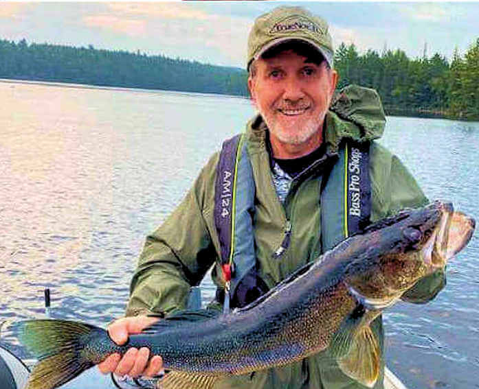 Garden Island Lodge American Plan angler displays giant trophy walleye. Garden Island Lodge American Plan angler displays giant trophy walleye.