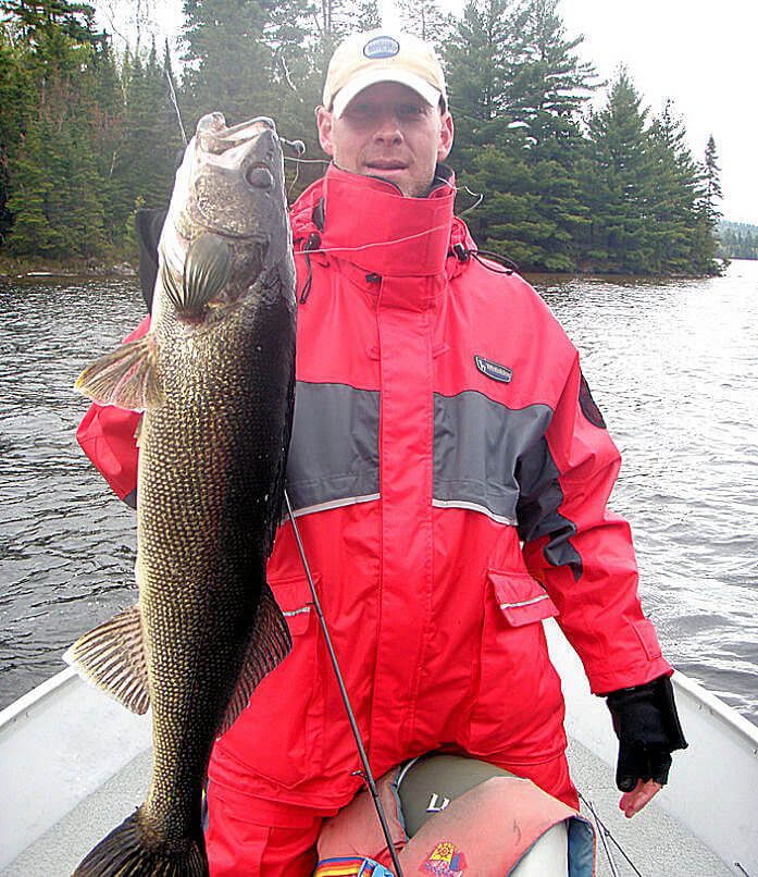 Garden Island fisherlady with a beautifully colored Lady Evelyn Lake Ontario walleye just before it was released.