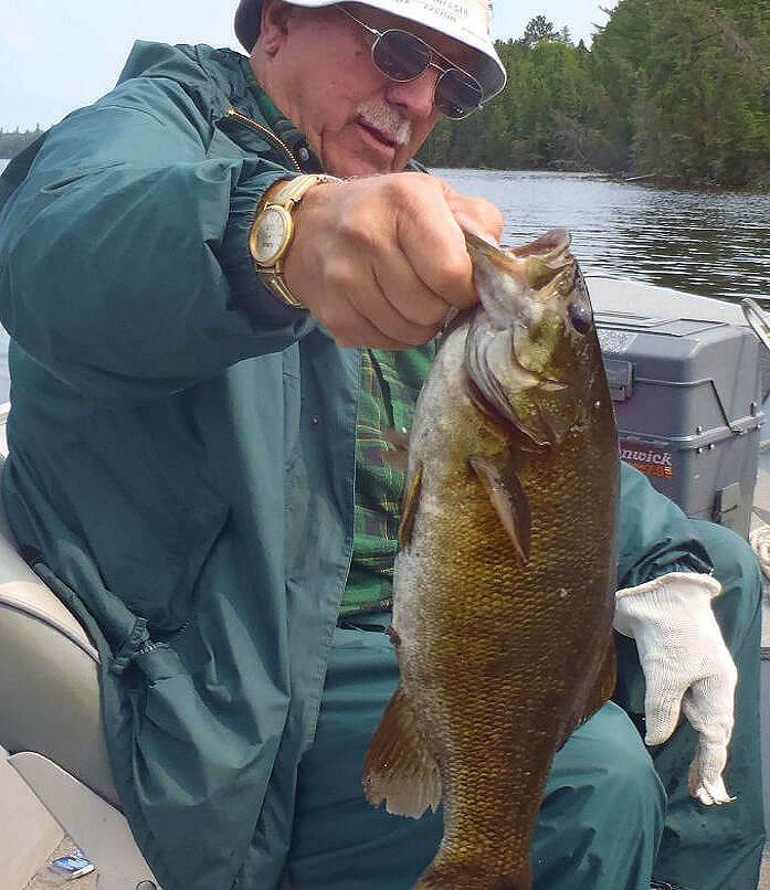 Really big smallmouth bass held out for a picture before getting released.