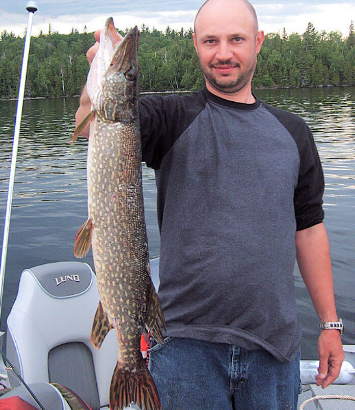 Garden Island Lodge angler holding trophy Ontario northern pike.