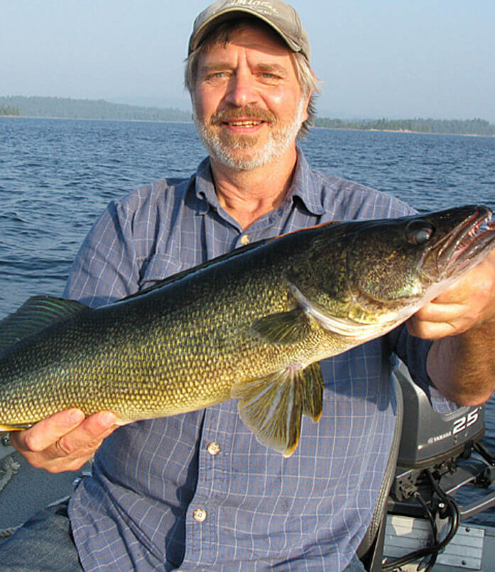 Garden Island angler holding up trophy Ontario walleye.